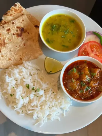 The essence of comfort food. A simple plate of rice, dal, a hearty potato curry, and roti. It's the kind of soulful meal I grew up with and love to share with you.