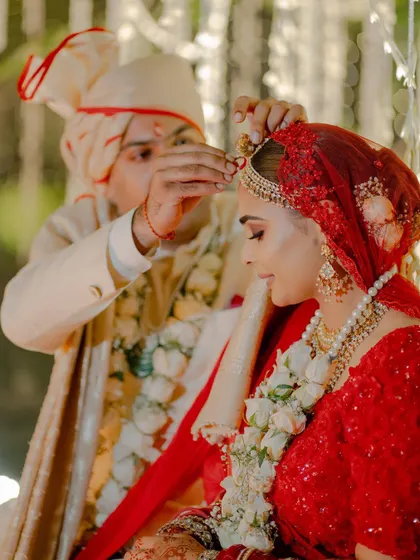 The sacred sindoor moment. A close up that captures the emotion and the beautiful details of the bride's makeup and hair.