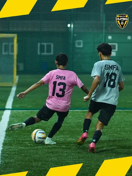 A glimpse into a competitive training match. Here, two players battle for the ball, showcasing the speed and skill that we cultivate in our academy. This is where game-changers are made.