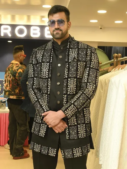 The same client posing in the black and silver jacket, showing how it looks with a pair of cool sunglasses.