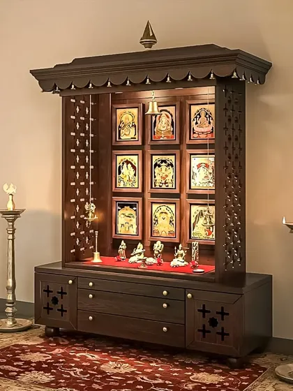 We designed this wooden pooja unit to beautifully display a collection of deities and sacred images. The open-shelf design is complemented by intricate jali work on the sides and a spacious base cabinet for storing pooja essentials, making it both an altar and a gallery.