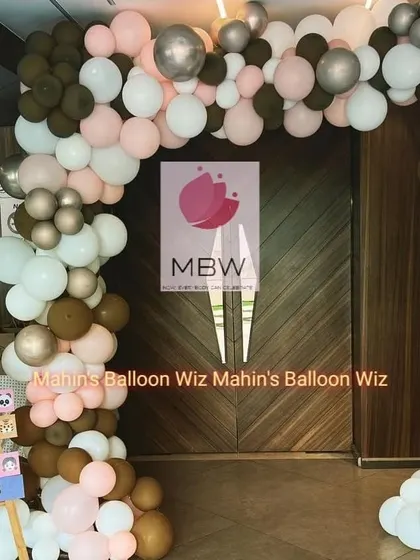 A full view of the stylish entrance arch, showing how it perfectly frames the doorway to the event.