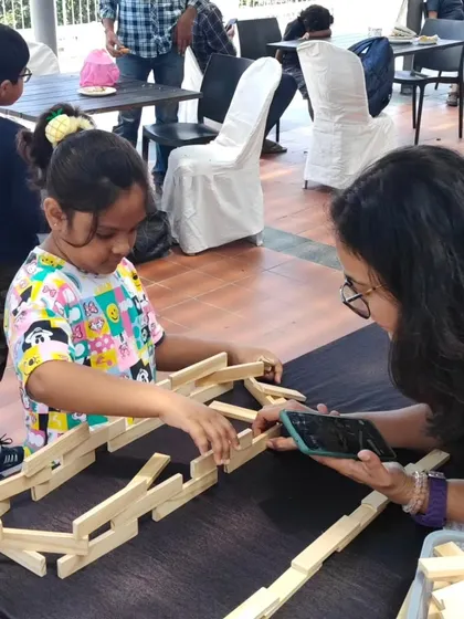 A mentor's guidance can help spark a new idea or solve a tricky structural problem. I encourage interaction and provide support when needed, helping children feel confident in their ability to execute their creative vision.