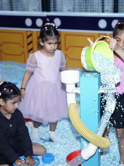 Teamwork makes the dream work! Young children collaborate at our sensory play station, learning and having fun together.