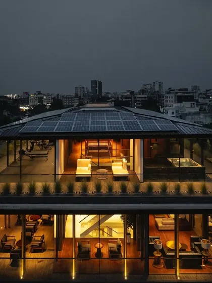 As night falls, 'The Light House' transforms into a warm beacon against the city skyline. The design ensures that the home feels just as inviting and alive after sunset, with carefully planned lighting that highlights its architectural form and the life within.