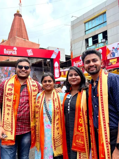 A duplicate of the group visiting one of the Manache Ganapathi temples, an important part of Pune's culture.