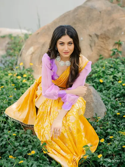 The combination of the yellow saree and the lavender blouse is unexpected and beautiful, showcasing my love for creative pairings.