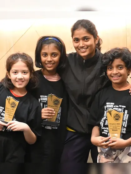 Our young female winners from the kids' BJJ tournament with their coach. We are proud to have a strong and growing group of girls in our grappling programs.