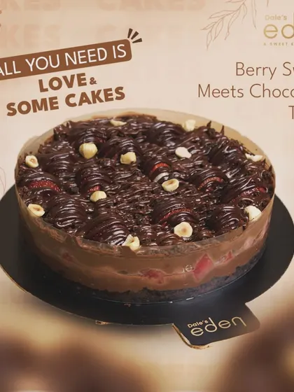 A berry sweet chocolate treat. This dessert features a rich chocolate base topped with fresh berries and hazelnuts, drizzled with even more chocolate for a perfect combination of flavors.