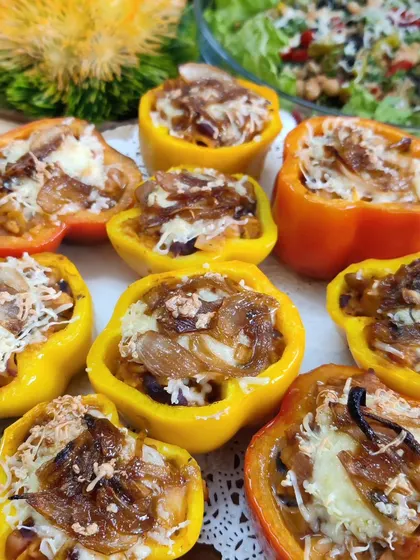 Our Mexican Stuffed Bell Peppers are baked to perfection. The peppers are filled with a savoury mix of rice and vegetables, then topped with caramelized onions and melted cheese.