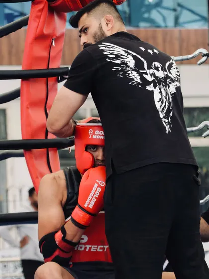 Cornering my fighter between rounds. Strategy, guidance, and a moment to regroup before going back to war.