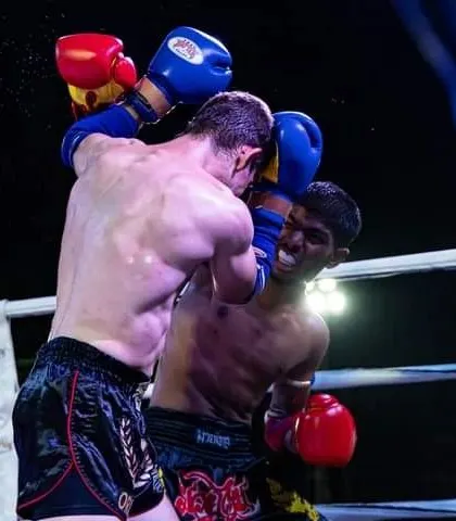 An intense exchange of punches in the corner of the ring. Our fighters are trained to be comfortable and dangerous in all situations.