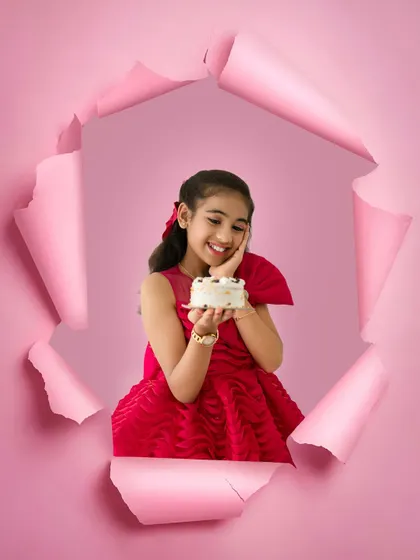A creative and fun birthday portrait for an older child. This unique paper-tear effect adds a pop of color and personality, making her birthday photos truly one of a kind.