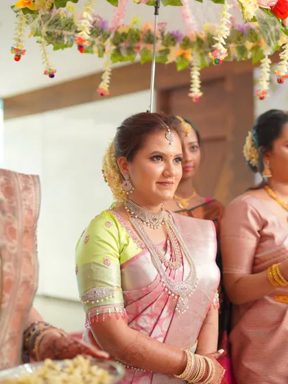 A royal South Indian bridal look. The bride looks radiant during her ceremony, with glowing makeup that enhances her features.
