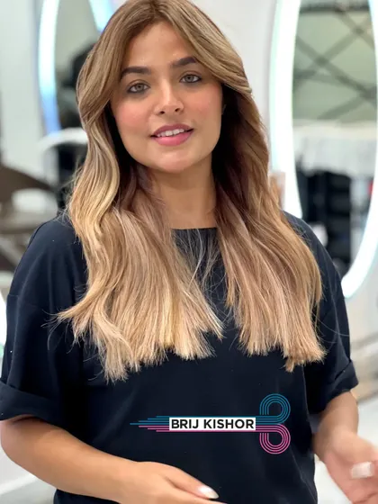 A creamy peach ash blonde teasing balayage. This look is soft, dreamy, and shines bright with a unique pastel tint.