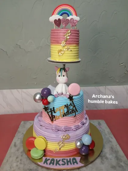 This magical unicorn cake uses a spacer to create a floating top tier among the clouds and rainbows. It's a whimsical design that little ones adore.