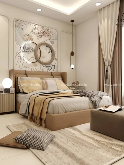 A bedroom that embodies relaxed luxury with its soft beige tones and artistic wall panel. The modern bedside lamps and plush ottoman add to the sophisticated and comfortable vibe.