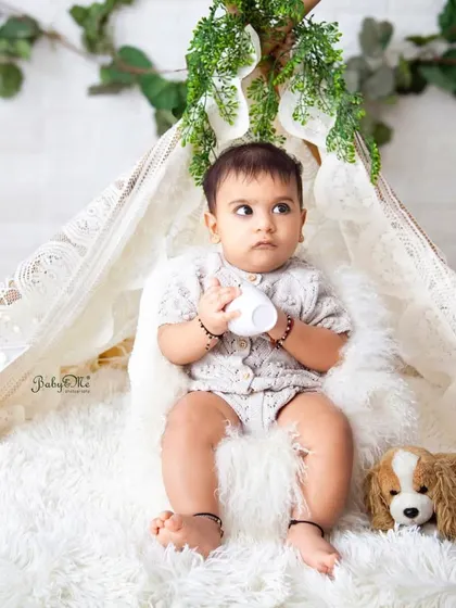A thoughtful moment during his six-month session. I always aim to capture a variety of moods and expressions that show your baby's full personality.