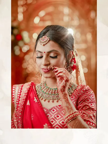 A beautiful, backlit close-up of the bride, her serene expression and intricate jewelry creating a stunning portrait.