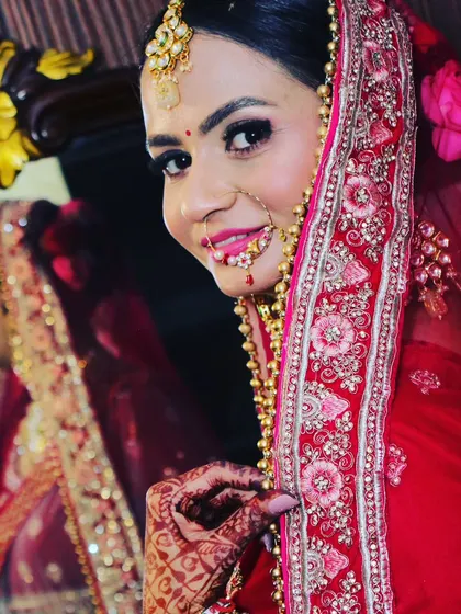 A bride looks over her shoulder into the mirror, a classic shot capturing a final check before the ceremony.