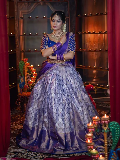 A regal pose in a grand setting, this look is elevated by our complete temple jewellery set.