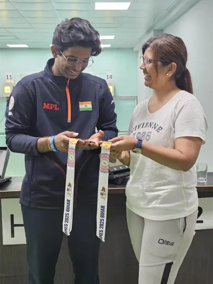 The joy of achievement shared between coach and athlete. Parth Mane shows his medals to Suma Shirur upon his return.