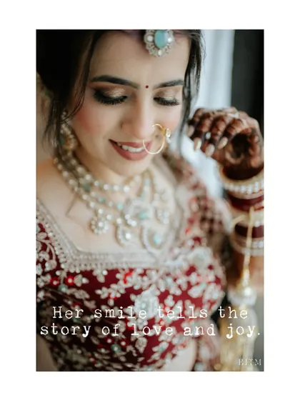 "Her smile tells the story of love and joy." A close-up of the bride's happy expression, capturing the genuine emotion behind her beautiful look.
