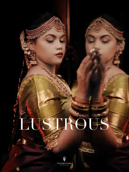 A stunning portrait titled "Lustrous," showing the bride and her reflection in a mirror, creating a dramatic and artistic effect.