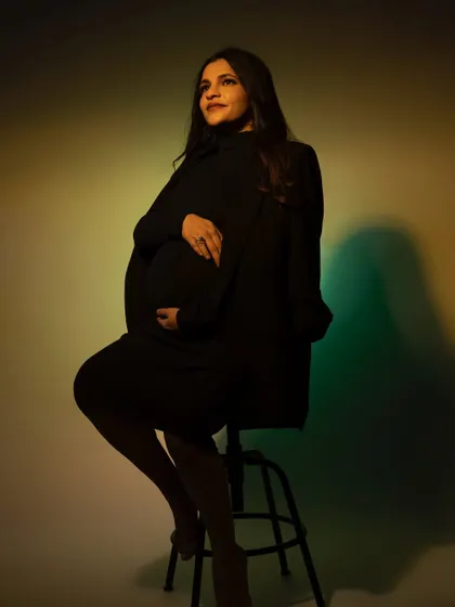 Playing with colored gels and light to create a modern, artistic portrait. This moody shot uses shadows and hues to create a unique and captivating image.