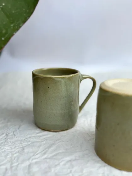 A closer look at our Green Celadon mugs. They have a simple, clean shape that's perfect for everyday use.