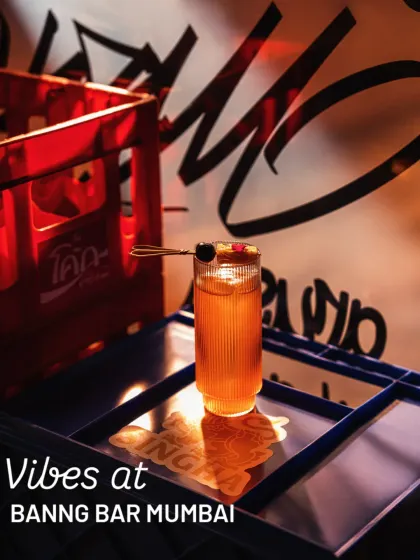 Capturing the edgy, street-style vibe of Banng Bar Mumbai. We used their branded crates and graffiti wall with dramatic red lighting to create a moody and authentic shot of their cocktail.