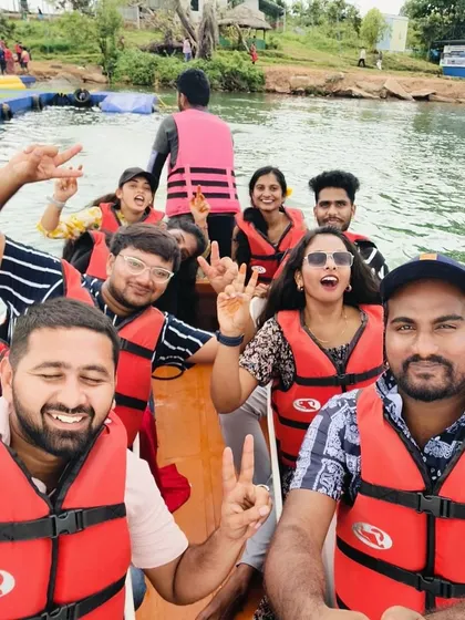 A selfie capturing the excitement of a boat ride in Coorg. Everyone is all smiles and ready for fun.
