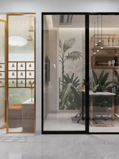 A view into one of the cabins in a transportation company's office, featuring a tropical-themed wallpaper and modern gold-accented shelving.