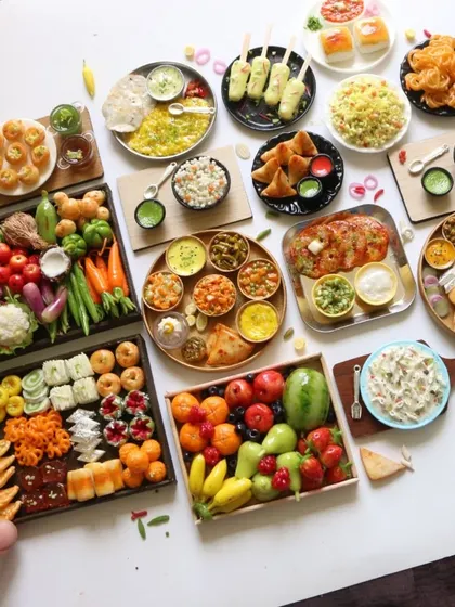 A beautiful display of my recent food miniature orders, including a basket of vegetables and fruits.