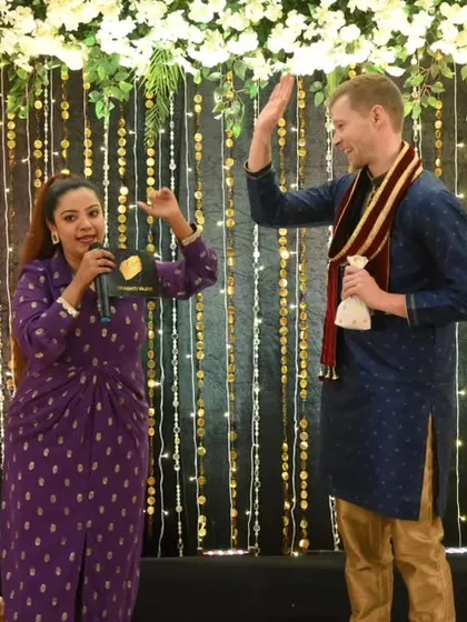 High-fives and happy faces after a successful game segment. My goal is to create a positive and rewarding experience for all participants, especially those new to Indian wedding traditions.