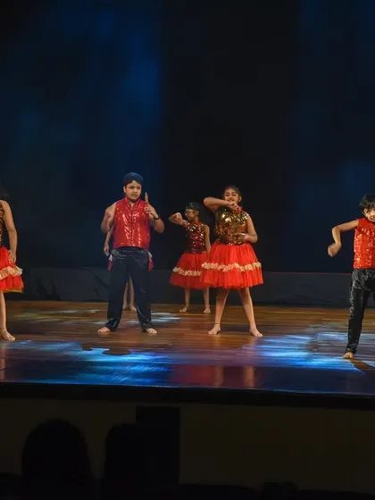 Our young performers in red and black, bringing high energy and sharp moves to their Bollywood showcase number.