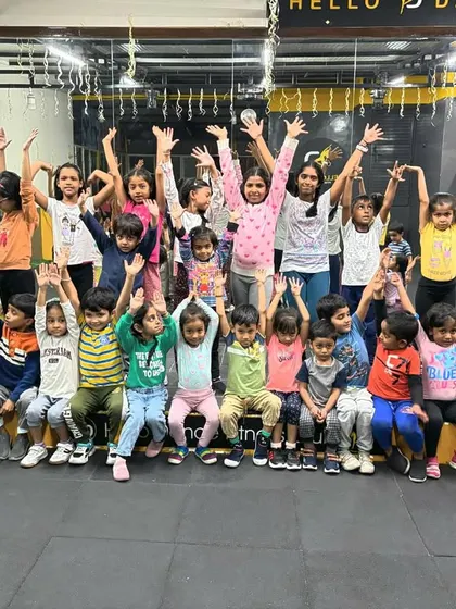 Arms up and full of joy! This picture captures the cheerful and celebratory spirit of our kids' batch after a great class.