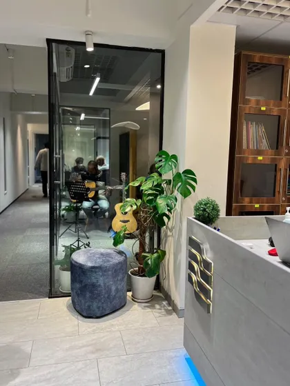 A view of our school's modern interior, with a lesson visible through the glass. We've created a transparent and open learning environment.