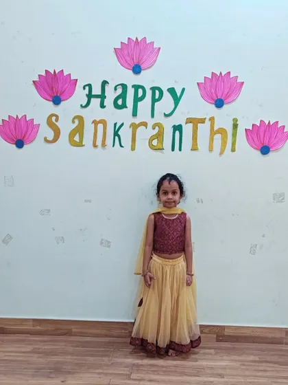 A duplicate of a previous image, showing a student dressed for the Makar Sankranti celebration.