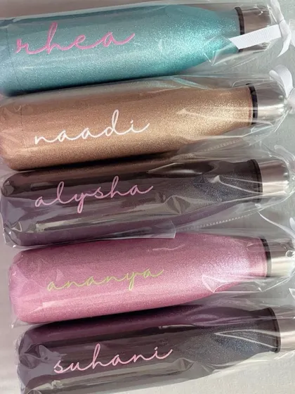 A lineup of our sparkle chic bottles, all packed and ready to be gifted. They make fantastic presents for bridesmaids, birthdays, or any special occasion.
