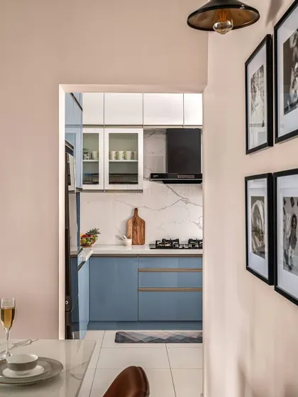 Looking into the kitchen from the dining area, you can see how the compact space is designed for maximum efficiency without sacrificing style.