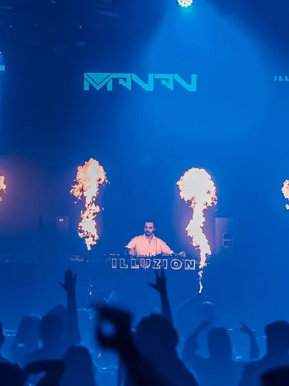 A wall of fire creates a stunning backdrop for my set. It's a high-impact visual that matches the music's intensity.