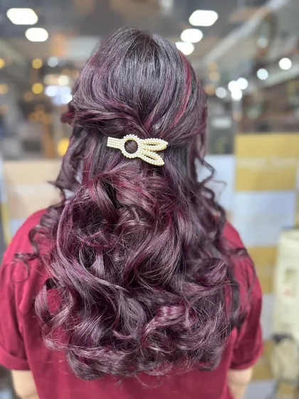 A simple, elegant hair clip is all you need to style these beautiful Plum Red highlights and curls for a special event.