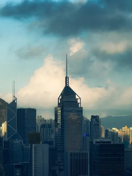 A telephoto shot focusing on the unique architecture of one of Hong Kong's skyscrapers against a cloudy sky. I enjoy isolating architectural details to appreciate their design.