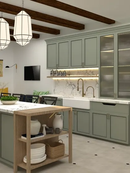 Another view of the farmhouse-style kitchen, showing the large central island that provides extra workspace and storage. The glass-front cabinets are great for displaying beautiful crockery, and the pendant lights add to the classic charm.