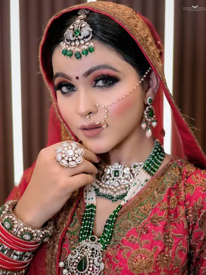 A powerful and direct portrait. The bride's confident gaze and the stunning details of her jewellery make this a very striking image.
