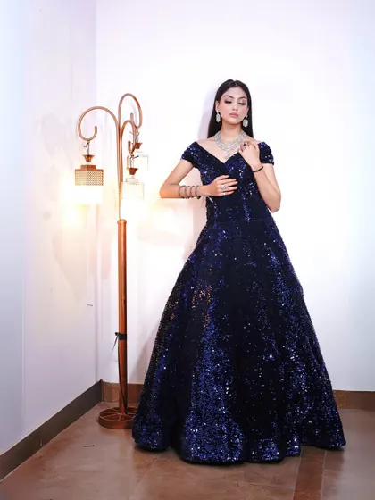 A final full-length shot of the blue sequin gown, a guaranteed head-turner.