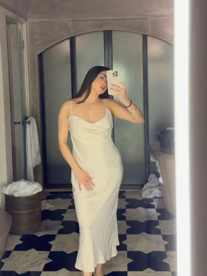 A throwback to my trip to Jaipur. This mirror selfie in a beautiful white satin dress captures the aesthetic of the city's stunning architecture, a perfect blend of personal style and travel content.