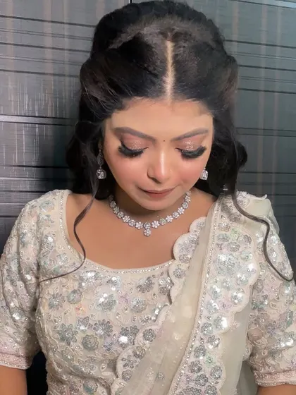 The complete look with the elegant half-up hairstyle. She looks absolutely ready for her engagement party.