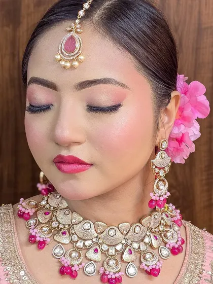 A beautiful pink meena Polki set, available for sale. This includes the necklace, earrings, and tika.
